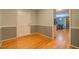 Entryway view featuring hardwood floors, neutral paint, and a glimpse of the kitchen at 308 Tulipwood Sw Cir, Conyers, GA 30094