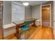 Bright kitchen nook featuring a rustic dining table and hardwood floors at 308 Tulipwood Sw Cir, Conyers, GA 30094