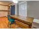 Cozy kitchen nook with a rustic wooden table and hardwood floors at 308 Tulipwood Sw Cir, Conyers, GA 30094