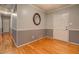 Neutral room with hardwood floors, gray walls with white trim and doors at 308 Tulipwood Sw Cir, Conyers, GA 30094