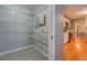 Spacious walk-in closet next to the kitchen, offering ample storage and easy access at 308 Tulipwood Sw Cir, Conyers, GA 30094