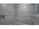 Spacious walk-in closet featuring ample shelving and neutral paint at 308 Tulipwood Sw Cir, Conyers, GA 30094