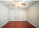 Bright bedroom featuring hardwood floors and a ceiling fan at 4932 Wilkins Station Dr, Decatur, GA 30035