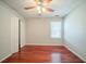 Sunlit bedroom featuring wood floors, closet, and neutral finishes at 4932 Wilkins Station Dr, Decatur, GA 30035