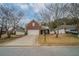 Charming single-Gathering home featuring a brick facade, well-manicured lawn, and attached two-car garage at 4932 Wilkins Station Dr, Decatur, GA 30035