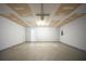 Spacious garage with concrete floor, unfinished ceiling, and white walls at 4932 Wilkins Station Dr, Decatur, GA 30035