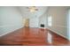 Spacious living room with hardwood floors, a fireplace, and abundant natural light at 4932 Wilkins Station Dr, Decatur, GA 30035