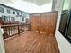 Private back deck with wood flooring, a privacy screen, and a view of the surrounding neighborhood at 532 Healy Dr # 61, Cumming, GA 30040