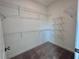 Walk-in closet with adjustable wire shelving for optimal storage at 532 Healy Dr # 61, Cumming, GA 30040