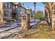 Community entrance featuring well-manicured landscaping and classic brick signage at 911 Telfair Close, Sandy Springs, GA 30350