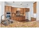 Well-appointed kitchen featuring granite counters, stainless steel appliances, and custom cabinets at 911 Telfair Close, Sandy Springs, GA 30350