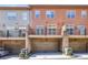 Townhome rear exterior shows garage parking and upper balconies for outdoor enjoyment at 911 Telfair Close, Sandy Springs, GA 30350