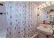 A bathroom with a white sink and patterned shower curtain at 3670 Union Ave, Atlanta, GA 30354