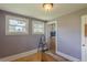 Bedroom features hardwood floors, two windows, storage chest, and doorway with closet at 3670 Union Ave, Atlanta, GA 30354