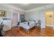 A bedroom with hardwood floors and a modern white bed at 3670 Union Ave, Atlanta, GA 30354