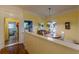 Bright dining area with hardwood floors, a classic light fixture, and an adjacent kitchen, perfect for entertaining at 3670 Union Ave, Atlanta, GA 30354