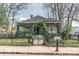 Charming home with beautiful foliage, well-maintained lawn and black fence at 3670 Union Ave, Atlanta, GA 30354