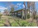 Side yard view of the home featuring mature foliage and lawn at 3670 Union Ave, Atlanta, GA 30354