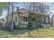 A house with a covered porch that has overgrown vines at 3670 Union Ave, Atlanta, GA 30354