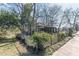 Charming home featuring mature trees and a wrought iron fence in a quiet neighborhood at 3670 Union Ave, Atlanta, GA 30354