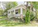 Home featuring a welcoming porch with detailed white railings, perfect for relaxing outdoors at 3670 Union Ave, Atlanta, GA 30354