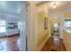 Bright hallway with hardwood floors leading to the bedrooms and bathroom showcasing the home's layout at 3670 Union Ave, Atlanta, GA 30354