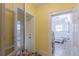Hallway entrance to a bathroom with a sink, tub, and black and white tile flooring at 3670 Union Ave, Atlanta, GA 30354
