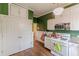 Cozy kitchen with white appliances, hardwood floors, and ample cabinet space at 3670 Union Ave, Atlanta, GA 30354