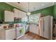 Well-lit kitchen featuring stainless steel appliances, white cabinets and plenty of storage at 3670 Union Ave, Atlanta, GA 30354