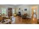 Bright living room featuring large windows, a fireplace, and hardwood floors throughout at 3670 Union Ave, Atlanta, GA 30354