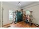 Versatile room with hardwood floors, natural light, and ample space for pets at 3670 Union Ave, Atlanta, GA 30354