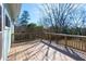 The deck has wooden railings and plenty of space to spread out at 5087 Fairmont Se Rd, Smyrna, GA 30082