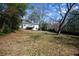 Extensive backyard with a deck and mature trees, offering an abundance of outdoor space and possibilities at 5087 Fairmont Se Rd, Smyrna, GA 30082