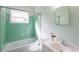 This bathroom offers tile walls around the bathtub, a modern toilet and an elegant sink at 5087 Fairmont Se Rd, Smyrna, GA 30082