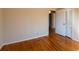 This bedroom features beautiful hardwood floors and a large closet with paneled doors at 5087 Fairmont Se Rd, Smyrna, GA 30082