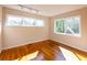 This bedroom has two large windows with hardwood floors and plenty of natural light at 5087 Fairmont Se Rd, Smyrna, GA 30082