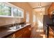 Kitchen featuring stainless steel appliances, double sink, and hardwood floor at 5087 Fairmont Se Rd, Smyrna, GA 30082