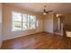 Open living room with hardwood floors, multiple windows, closet, stairs, and natural light at 5087 Fairmont Se Rd, Smyrna, GA 30082