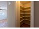 Walk-in pantry with shelving and hardwood flooring at 5087 Fairmont Se Rd, Smyrna, GA 30082