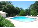 Community pool offering a refreshing retreat with lounge chairs and lush surroundings at 91 East Meadow Ln, Conyers, GA 30012