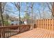 Outdoor deck with wood railing overlooks wooded backyard at 1069 Falling Water Se Dr, Smyrna, GA 30080