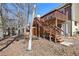 View of a back exterior with a door, porch, and wooden stairway at 1069 Falling Water Se Dr, Smyrna, GA 30080