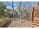 Exterior view of a backyard with a wooden fence, shed, and back of house at 1069 Falling Water Se Dr, Smyrna, GA 30080