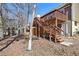 Backyard with deck, exterior stairs, and mature trees at 1069 Falling Water Se Dr, Smyrna, GA 30080