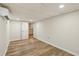 Finished basement featuring new floors, recessed lights, and efficient AC wall unit at 1069 Falling Water Se Dr, Smyrna, GA 30080