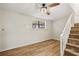 Basement area with light wood floors, a window and a staircase at 1069 Falling Water Se Dr, Smyrna, GA 30080