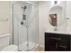 Updated bathroom with glass-enclosed shower, vanity, and modern fixtures at 1069 Falling Water Se Dr, Smyrna, GA 30080