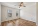 Comfortable bedroom featuring two windows, a ceiling fan and wood laminate flooring at 1069 Falling Water Se Dr, Smyrna, GA 30080