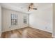 Bright bedroom features hardwood floors, a ceiling fan, and two large windows at 1069 Falling Water Se Dr, Smyrna, GA 30080