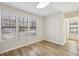 Bedroom with wood floors, neutral walls, three windows with blinds and a flush mount light at 1069 Falling Water Se Dr, Smyrna, GA 30080